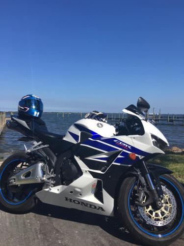 blue and white Honda motorcycle